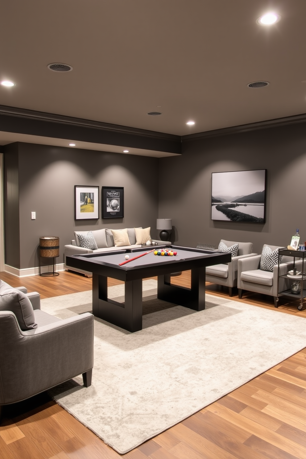 A game area featuring a sleek pool table takes center stage in a spacious basement family room. The walls are painted a warm gray, complemented by recessed lighting that creates an inviting atmosphere. Surrounding the pool table are plush seating options, including a sectional sofa and stylish armchairs. A large area rug anchors the space, while a bar cart in the corner adds a touch of sophistication for entertaining guests.
