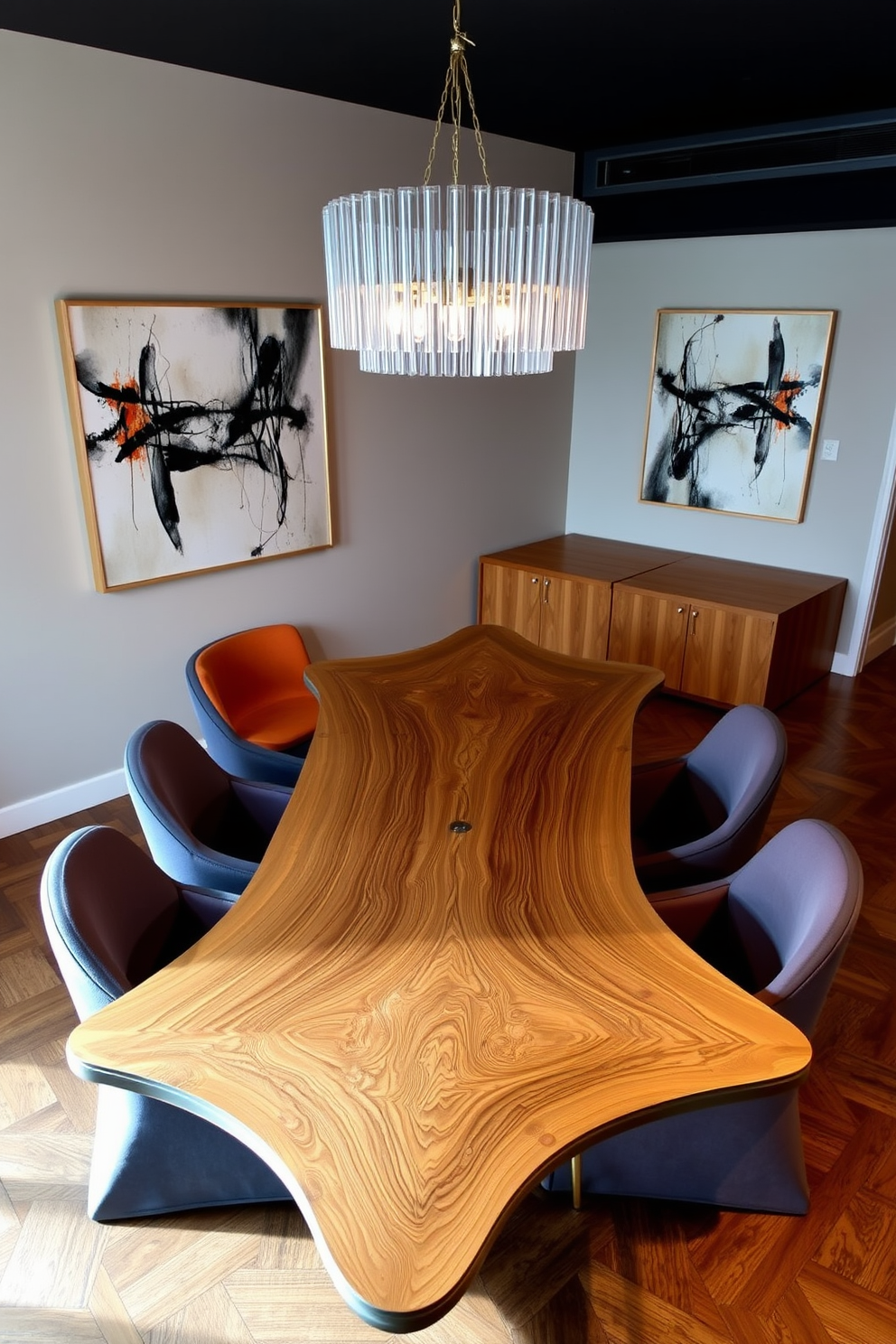 A unique asymmetric dining table with a sleek wood finish takes center stage in the dining room. Surrounding the table are modern upholstered chairs in a complementary color, creating a harmonious balance in the space. The walls are adorned with abstract art that echoes the table's shape, adding a touch of creativity to the room. A statement chandelier hangs above, illuminating the table and enhancing the overall ambiance.