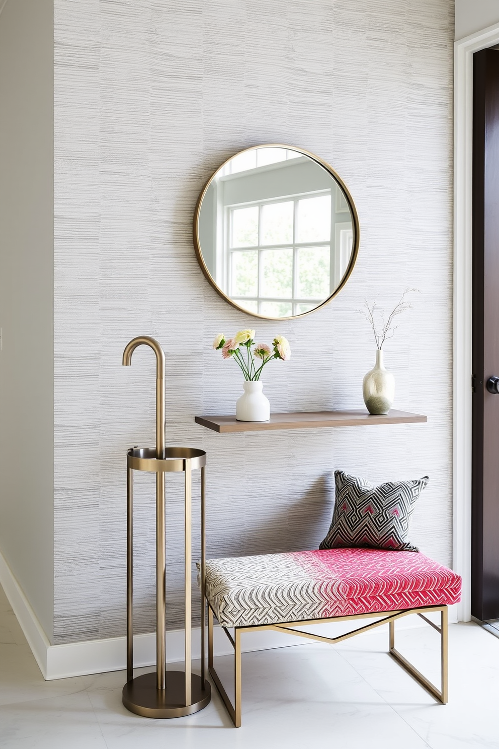 A stylish umbrella stand made of sleek metal with a modern design sits in the corner of the entrance foyer. The stand is accompanied by a small bench upholstered in a vibrant fabric, creating a welcoming and functional space. The entrance foyer features a statement wall adorned with textured wallpaper in soft gray tones. A round mirror with a minimalist frame hangs above a console table, reflecting natural light and enhancing the overall ambiance.