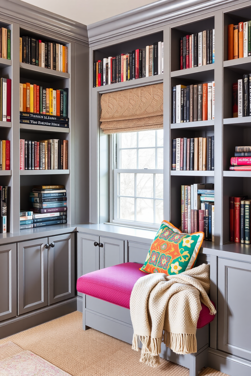 A classic gray home library featuring built-in bookshelves that stretch from floor to ceiling. A comfortable reading nook is adorned with vibrant accent pillows and a cozy throw blanket.