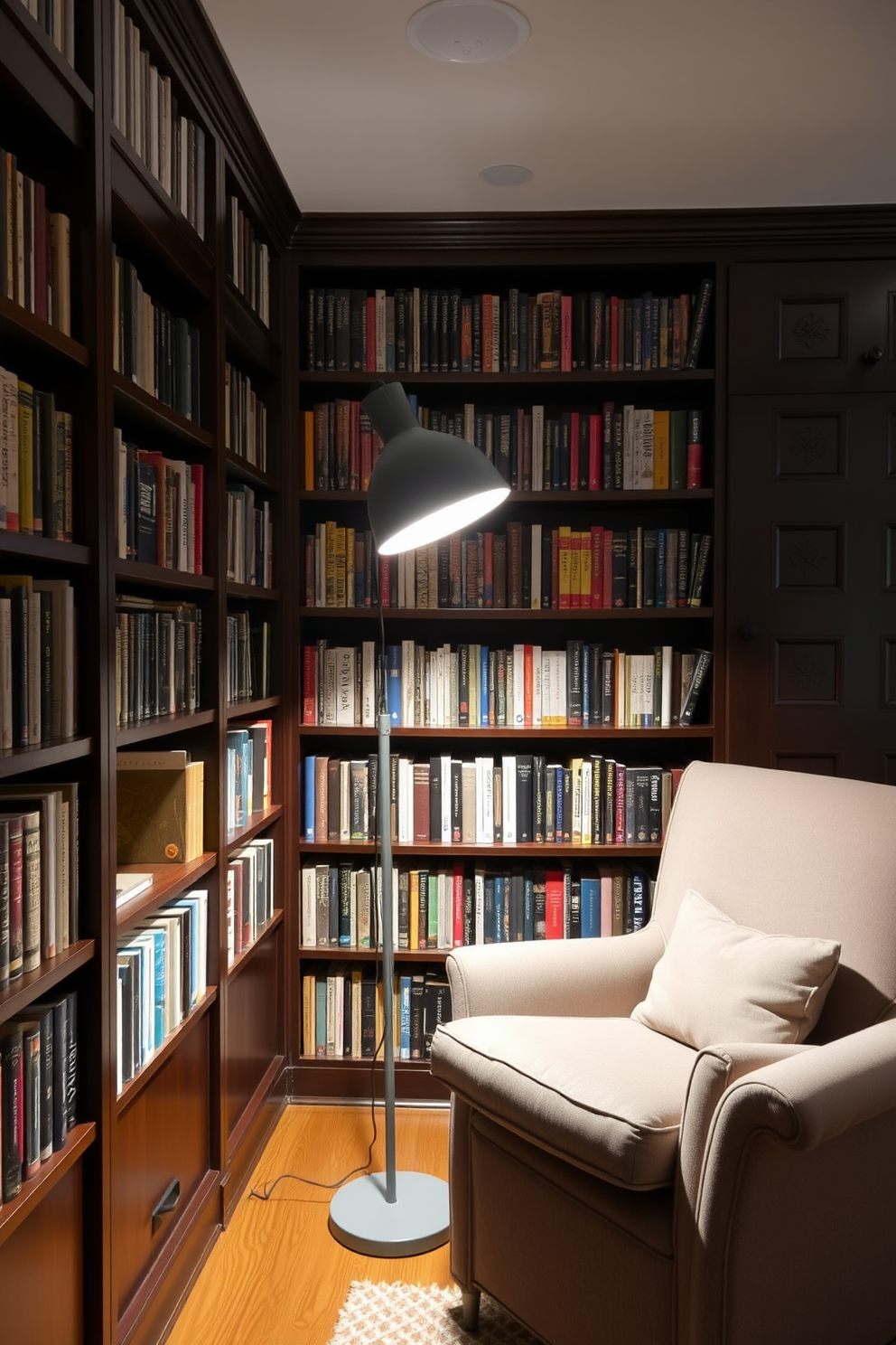 A cozy home library setting featuring a gray desk lamp that provides focused lighting for reading. The walls are lined with dark wooden bookshelves filled with an array of books, and a plush armchair sits in the corner, inviting relaxation.