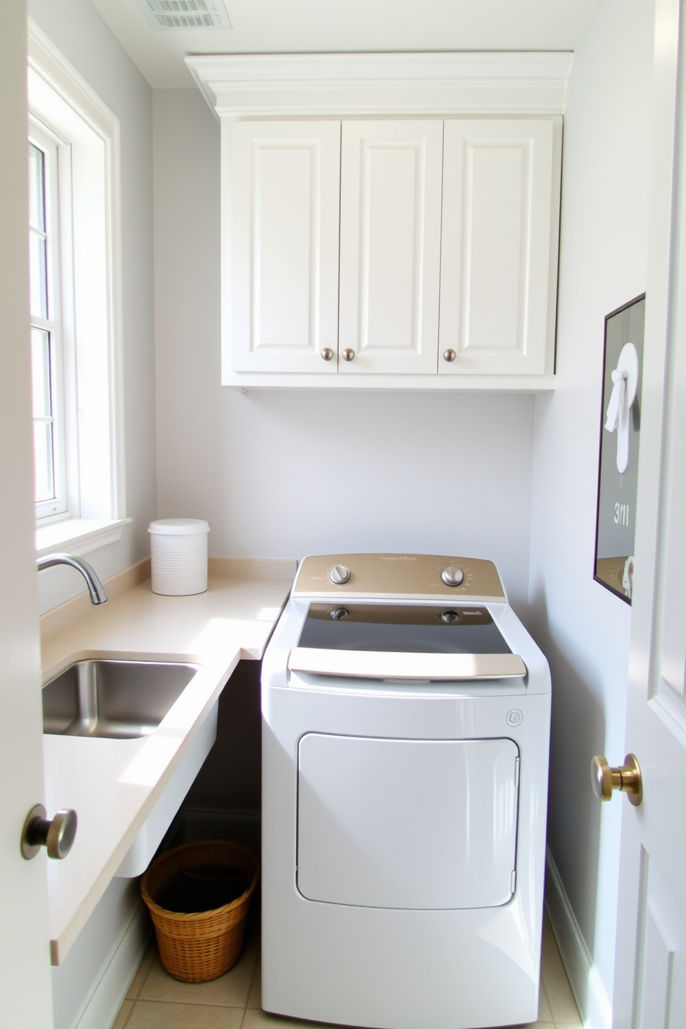 A bright and functional laundry room featuring a top-loading washer is designed for convenience. The room includes a spacious countertop for folding clothes, with a sleek sink installed next to the washer for easy access. The walls are painted in a light, airy color to enhance the natural light coming in from a nearby window. Ample storage is provided by white cabinetry above the washer, keeping laundry supplies organized and out of sight.