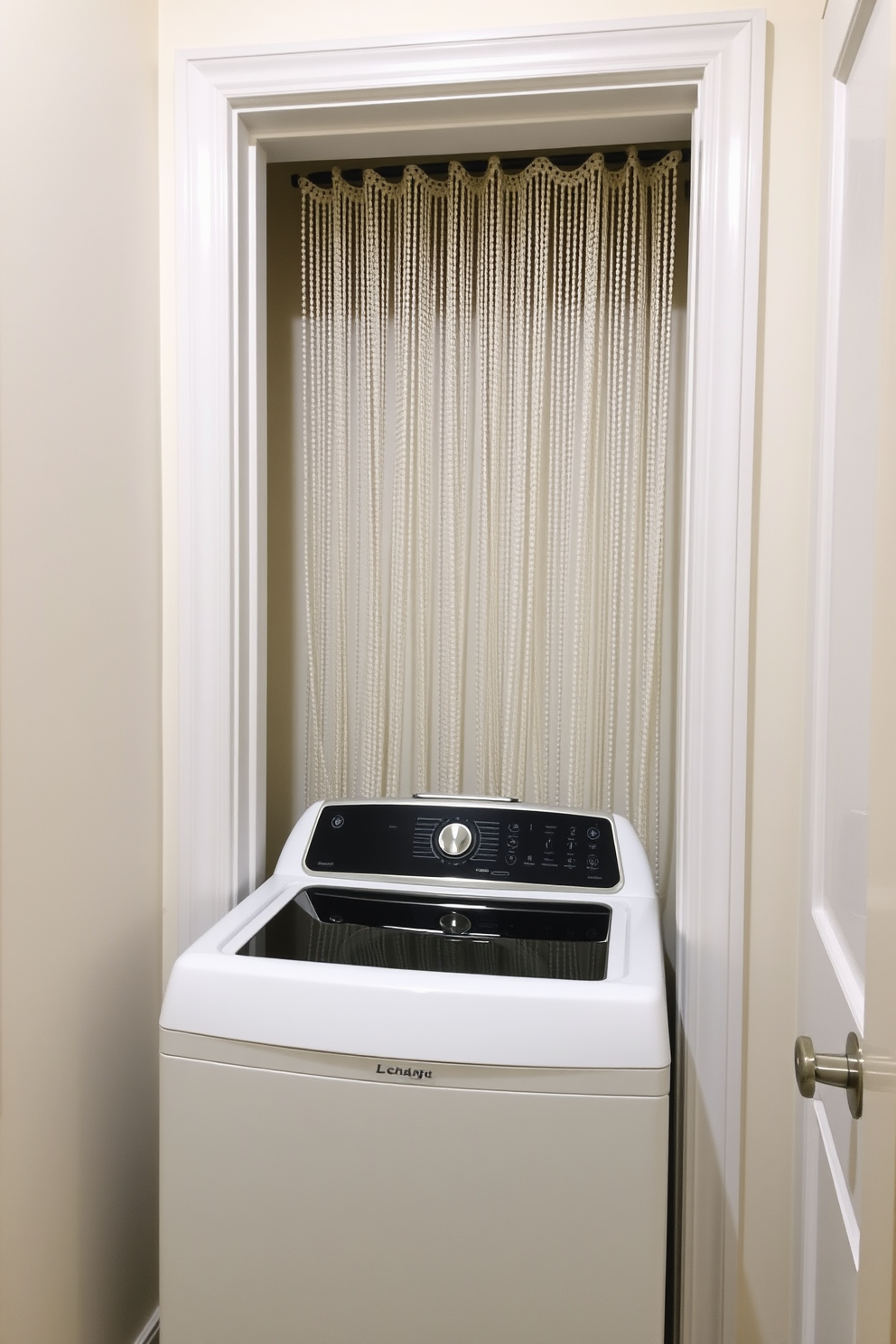 A stylish laundry room featuring a top-loading washer positioned against a wall. A beaded curtain hangs elegantly in the doorway, providing privacy while adding a touch of texture to the space.