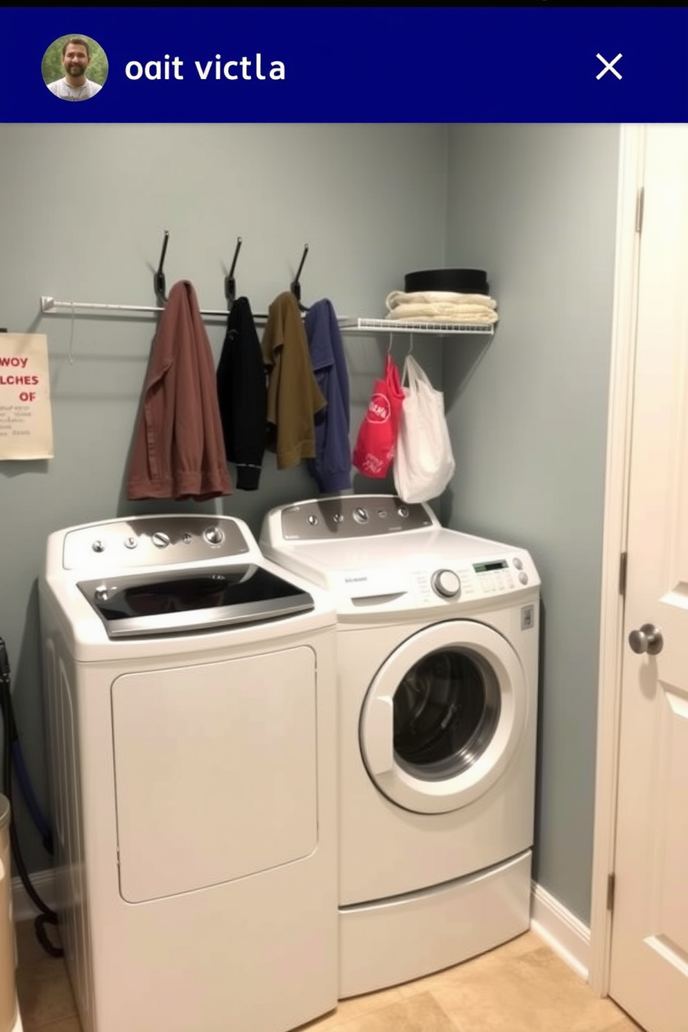 A functional laundry room featuring a top-loading washer positioned against a wall. Wall-mounted hooks provide easy access for hanging clothes and organizing laundry essentials.