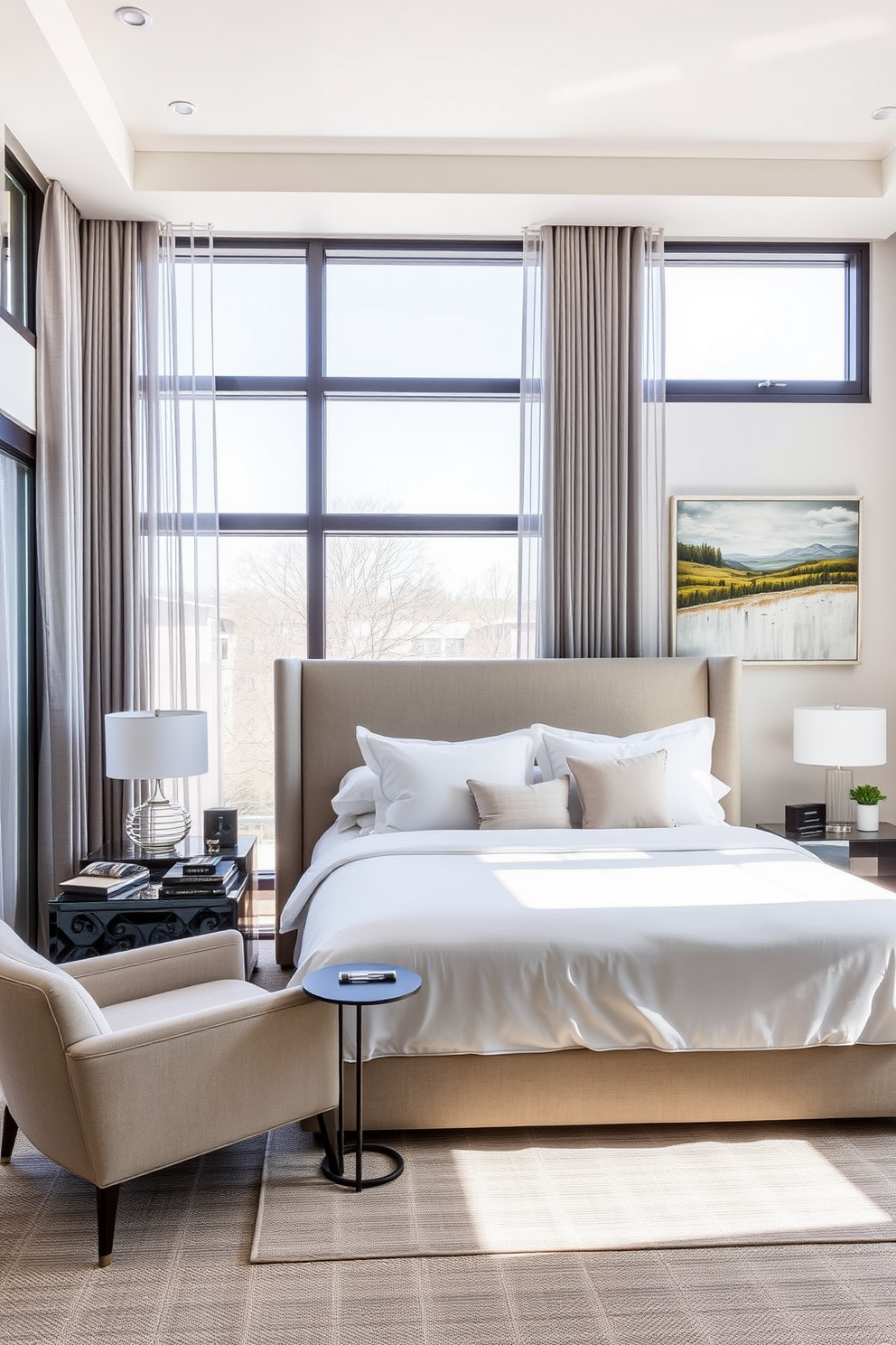 A sophisticated contemporary master bedroom features a king-sized bed with a plush upholstered headboard and crisp white linens. Floor-to-ceiling windows allow natural light to flood the space, complemented by sheer drapes in a soft gray hue. The room includes a minimalist nightstand on either side of the bed, each adorned with modern table lamps. A cozy reading nook is created with a stylish armchair and a small side table, positioned near a beautiful landscape painting on the wall.