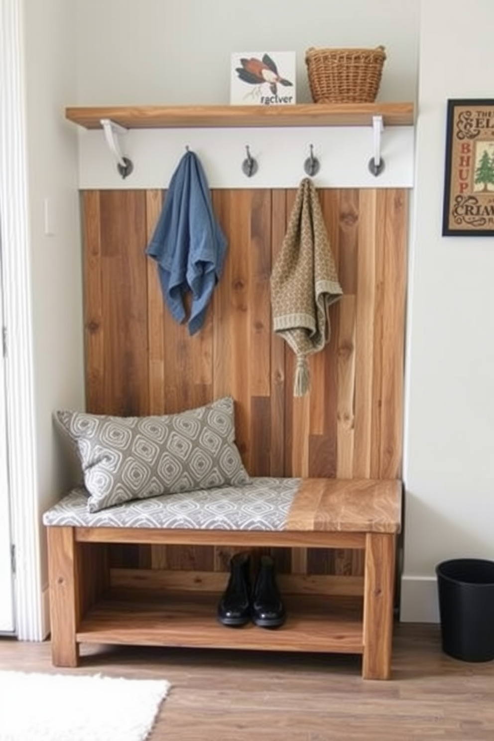 A stylish mudroom features a bench with a removable cushion cover that adds comfort and versatility. The bench is crafted from reclaimed wood, showcasing its natural grain, while the cushion is upholstered in a durable, patterned fabric that complements the overall decor.