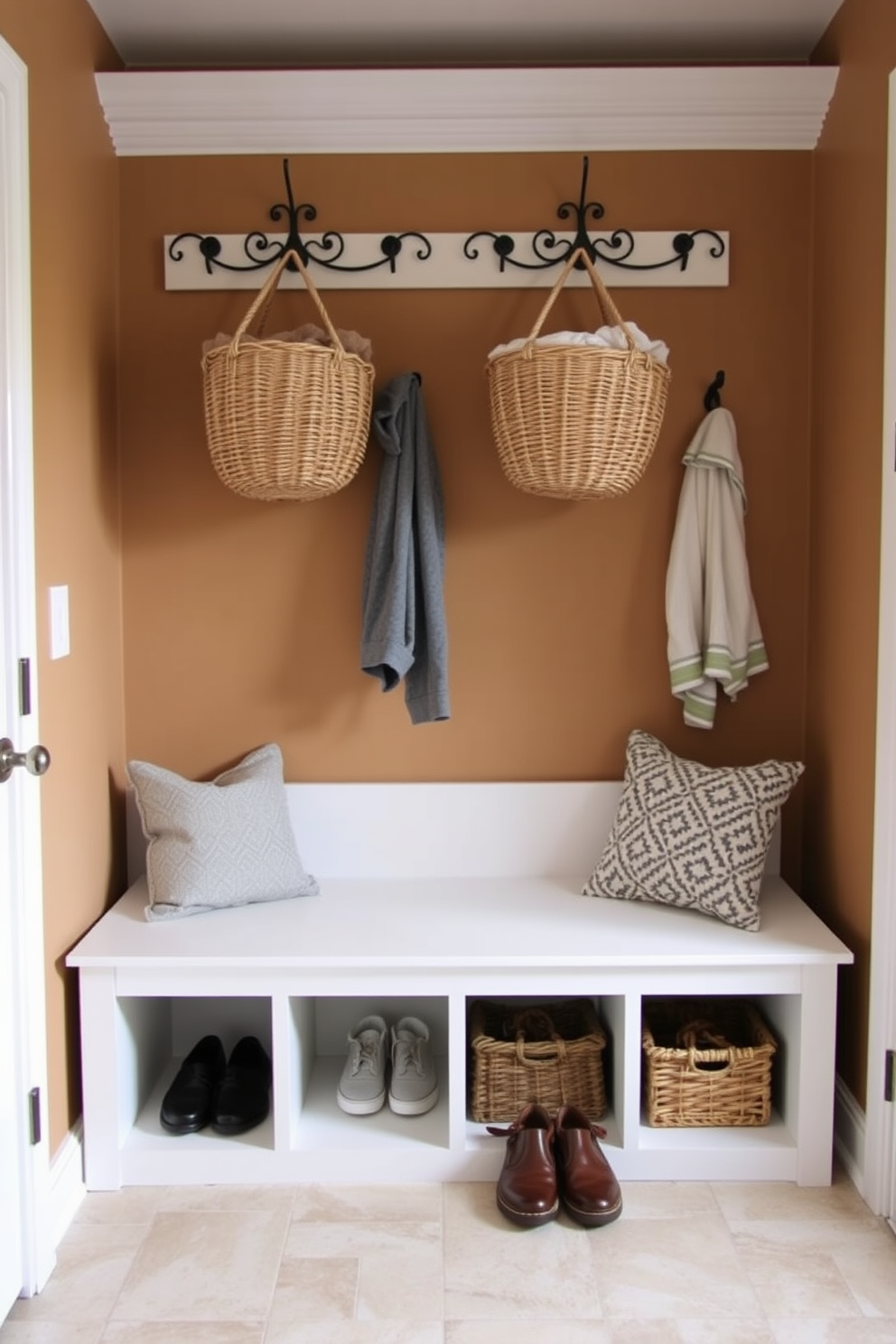 A functional mudroom with hanging baskets for quick storage. The walls are painted in a warm neutral tone, and the floor features durable, easy-to-clean tiles. Incorporate a built-in bench with cubbies underneath for shoe storage. Above the bench, decorative hooks hold the hanging baskets, providing easy access to everyday items.
