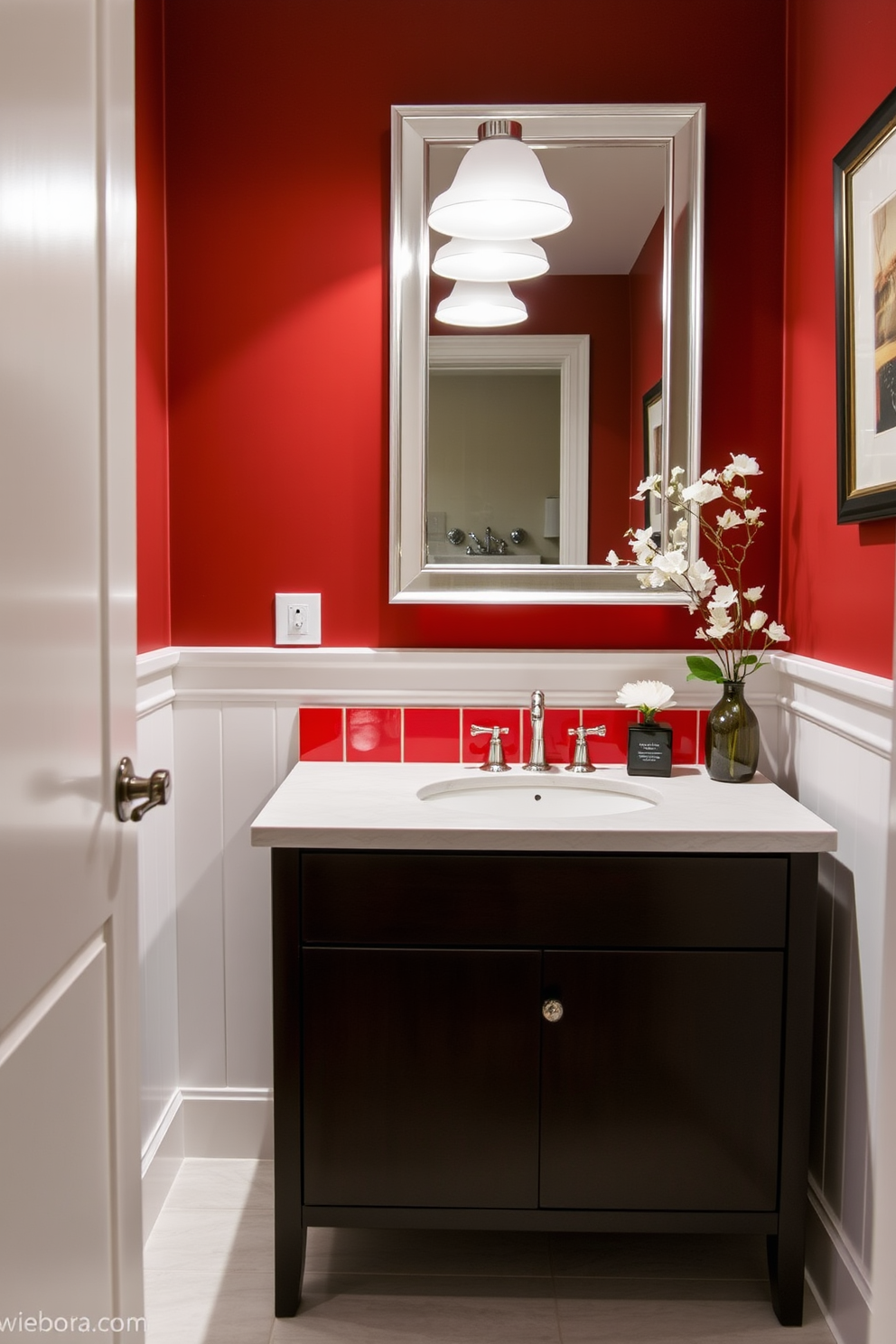 A sophisticated red tile backsplash enhances the sink area, creating a bold focal point in the room. The rich color contrasts beautifully with the sleek white fixtures and soft lighting, adding warmth and depth to the space. The powder room features elegant accessories that complement the red tones, including a stylish mirror and tasteful artwork. A chic vanity with a dark wood finish provides a striking balance against the vibrant backsplash, making the design both functional and visually appealing.