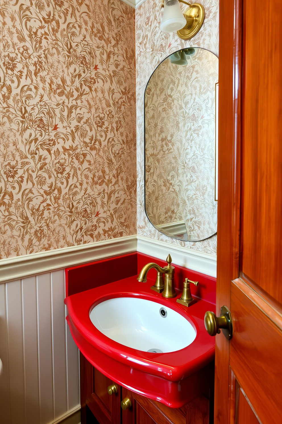 A vintage red sink with elegant brass fixtures serves as the centerpiece of the powder room. The walls are adorned with intricate wallpaper featuring floral patterns, creating a charming and inviting atmosphere. Rich wooden cabinetry complements the sink, providing ample storage for essentials. Soft, ambient lighting highlights the unique design elements, enhancing the overall vintage aesthetic.