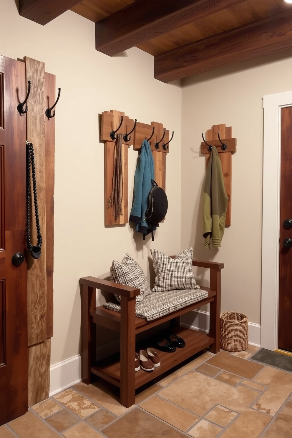 A decorative ladder made of reclaimed wood leans against a wall, showcasing an array of cozy blankets in various textures and colors. The ladder adds a warm and inviting touch to the space, creating a perfect focal point for relaxation. The rustic mudroom features a combination of shiplap walls and a vintage wooden bench, providing a charming entryway. Woven baskets are neatly arranged beneath the bench for storage, while a collection of hooks above holds hats and coats, enhancing the functionality and aesthetic appeal.