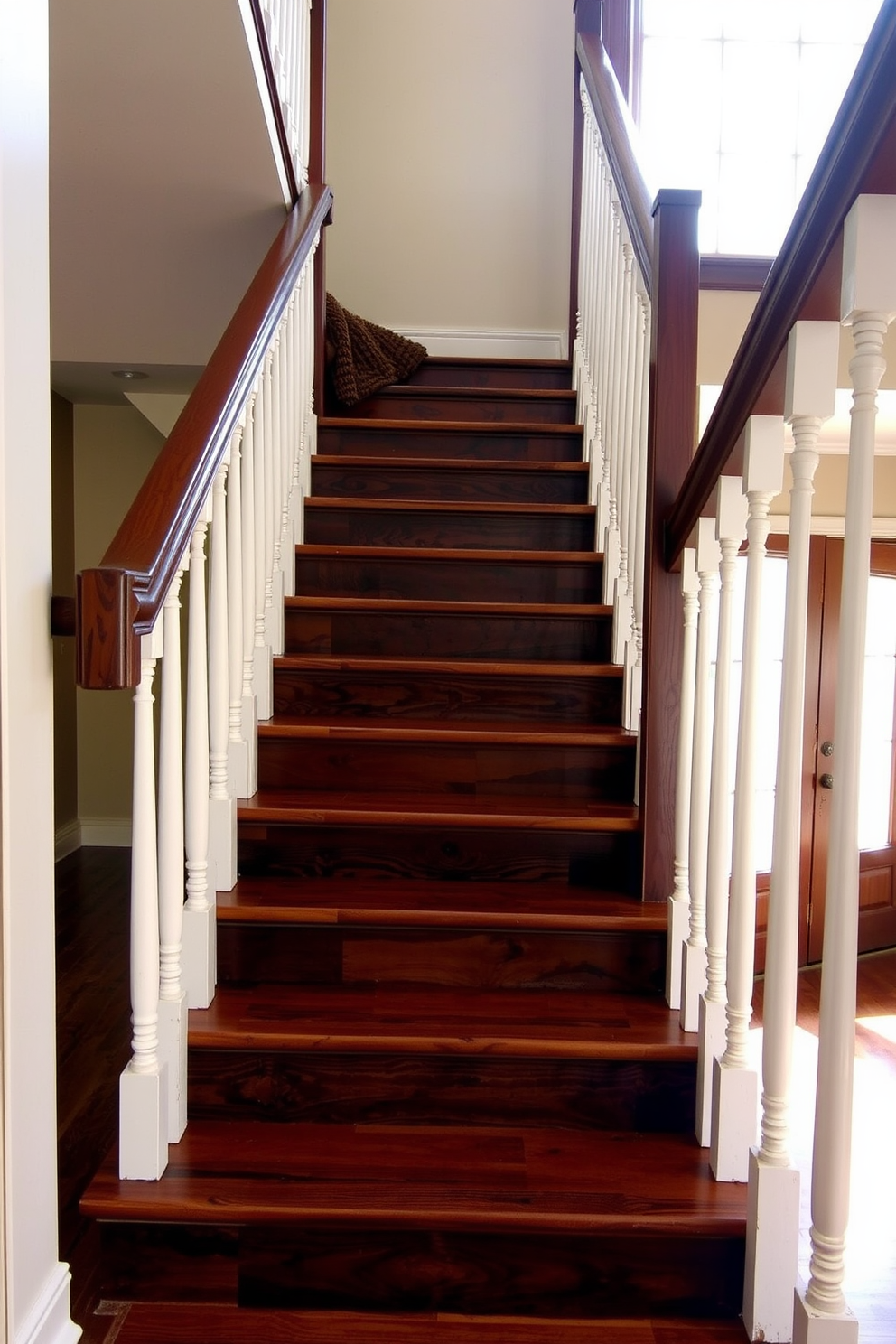 A rustic staircase design featuring dark stained wood steps complemented by white balusters that create a striking contrast. The staircase is adorned with a textured runner that adds warmth and character, while natural light filters in through a nearby window, enhancing the inviting atmosphere.