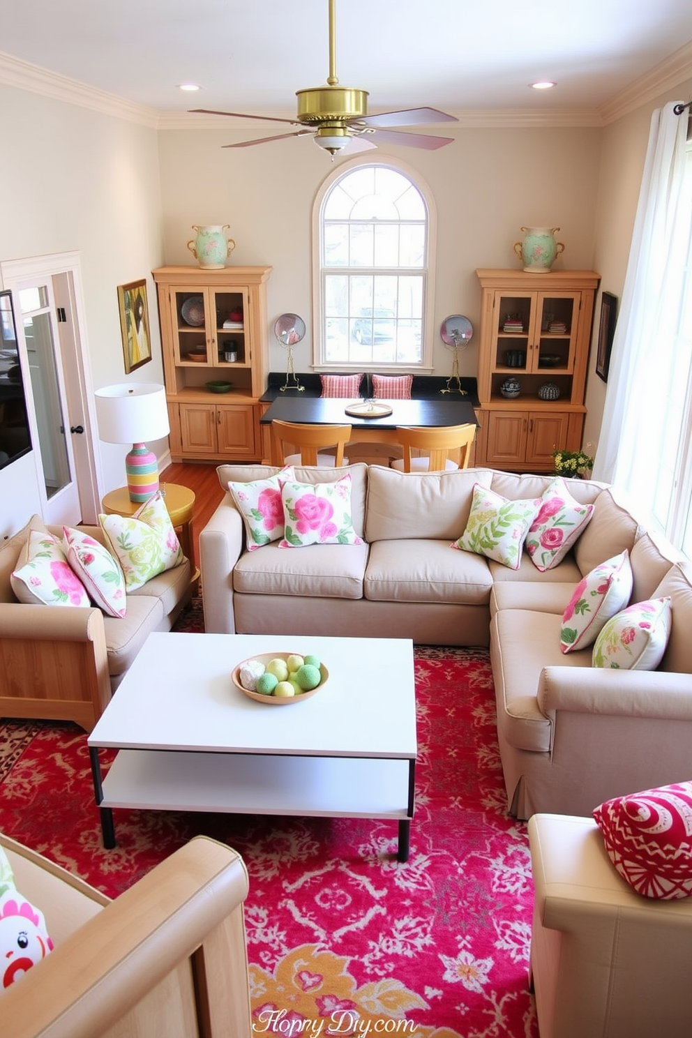 A cozy game room designed for spring. Light wood furniture creates a warm and inviting atmosphere, complemented by soft pastel accents throughout the space. A large, comfortable sectional sofa is arranged around a sleek coffee table, perfect for game nights. Bright throw pillows in floral patterns add a touch of seasonal charm, while a vibrant area rug ties the room together.