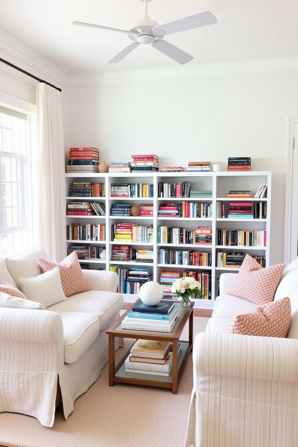 A cozy summer living room filled with natural light. The walls are painted in soft white, and the furniture features light, airy fabrics in pastel colors. In one corner, arrange vibrant stacks of books on the shelves, mixing sizes and colors for visual interest. Add a few decorative objects among the books to create a playful yet sophisticated atmosphere.