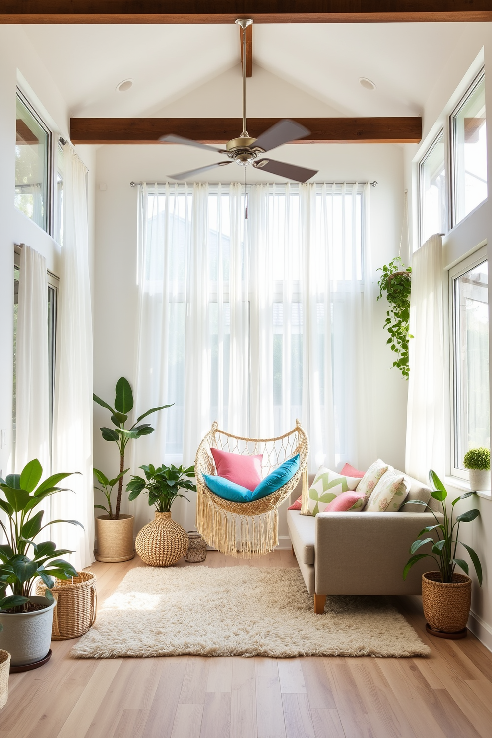 A cozy summer small living room features a hammock chair suspended from the ceiling, inviting relaxation and comfort. The walls are painted in a soft pastel hue, while natural light floods the space through large windows adorned with light, airy curtains. A plush area rug anchors the seating area, which includes a compact sofa and a couple of vibrant accent pillows. Potted plants are strategically placed around the room, adding a touch of greenery and freshness to the decor.