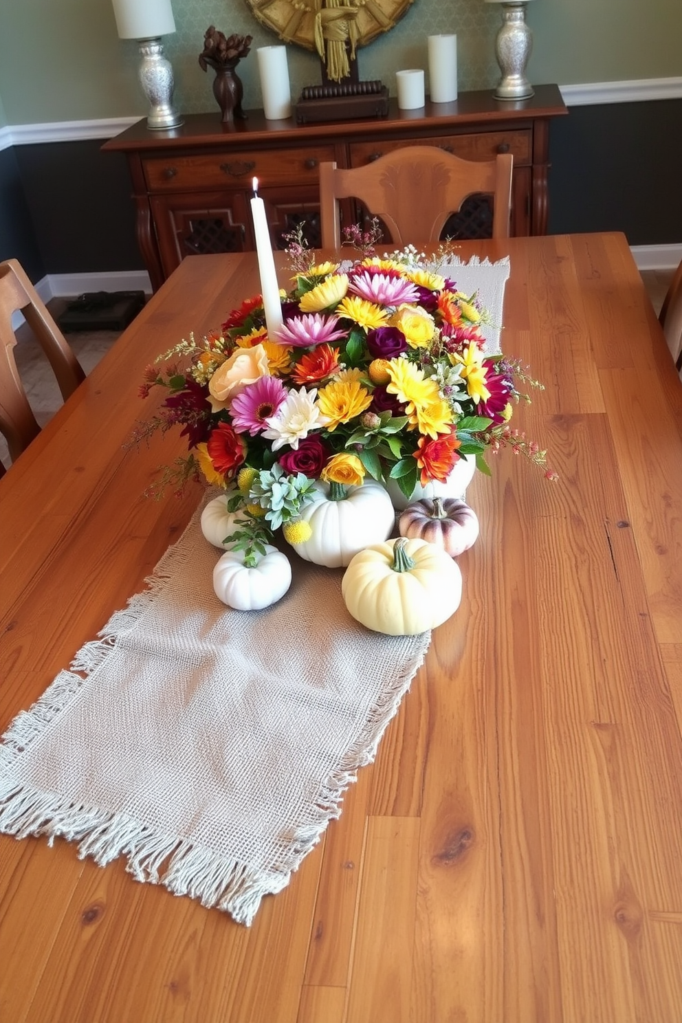 A warm and inviting dining table is adorned with an array of fall floral arrangements in rustic vases. The centerpiece features vibrant orange and deep red blooms, surrounded by lush greenery and accented with miniature pumpkins for a festive Thanksgiving touch.