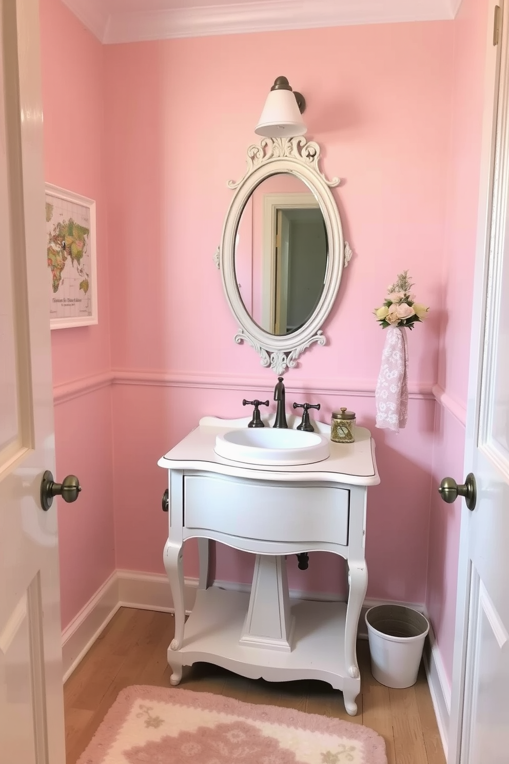 A charming powder room adorned in shabby chic decor featuring soft pastel colors. The walls are painted in a delicate blush pink, complemented by a distressed white vanity with a round porcelain sink. Antique-style fixtures in brushed nickel add a touch of elegance, while a vintage mirror with ornate detailing hangs above the vanity. The floor is covered in a light wood finish, and a plush area rug in pastel hues adds warmth to the space.