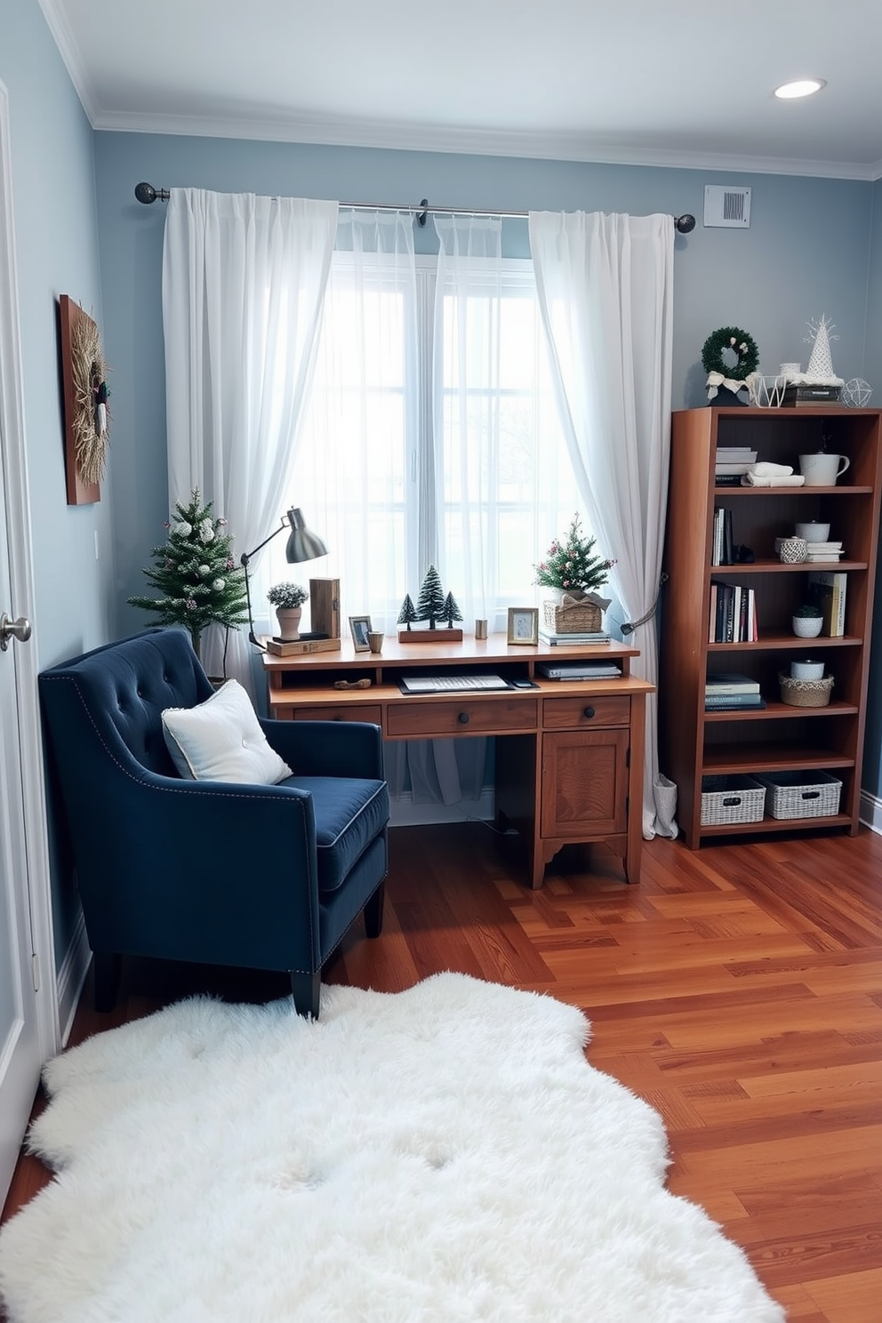 A cozy winter home office setting with a color scheme of soft whites and deep blues. A large wooden desk is positioned in front of a window adorned with sheer white curtains, allowing natural light to filter in gently. The walls are painted a calming icy blue, while a plush white area rug covers the hardwood floor. A stylish armchair in a rich navy fabric is placed beside the desk, complemented by a small wooden bookshelf filled with winter-themed decor and books.